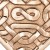 Celtic knot pendant made in natural uncoated bronze. Heart shaped. Front view.